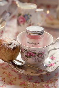 Original vintage tea cups to hire, with strawberry and cream candy jar favour presented inside the teacup.