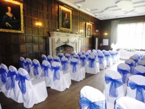 Fuschia chair covers with electric blue sash